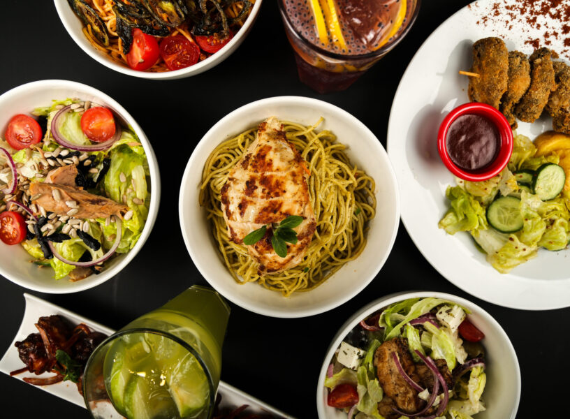 various types of salads and dishes on the table top view